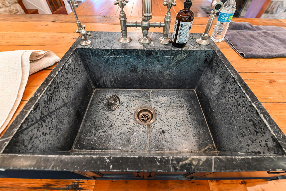 Rustic Traditional White & Navy Kitchen with Black AGA Range, Wood Top Island & Soapstone Countertops