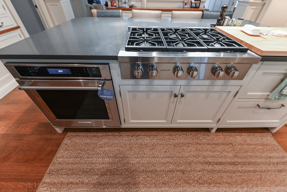 Large Traditional White Kitchen with Island, Stone Countertops & Desk Area