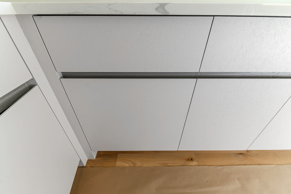 Large White Modern Kitchen with Island and Quartz Countertops