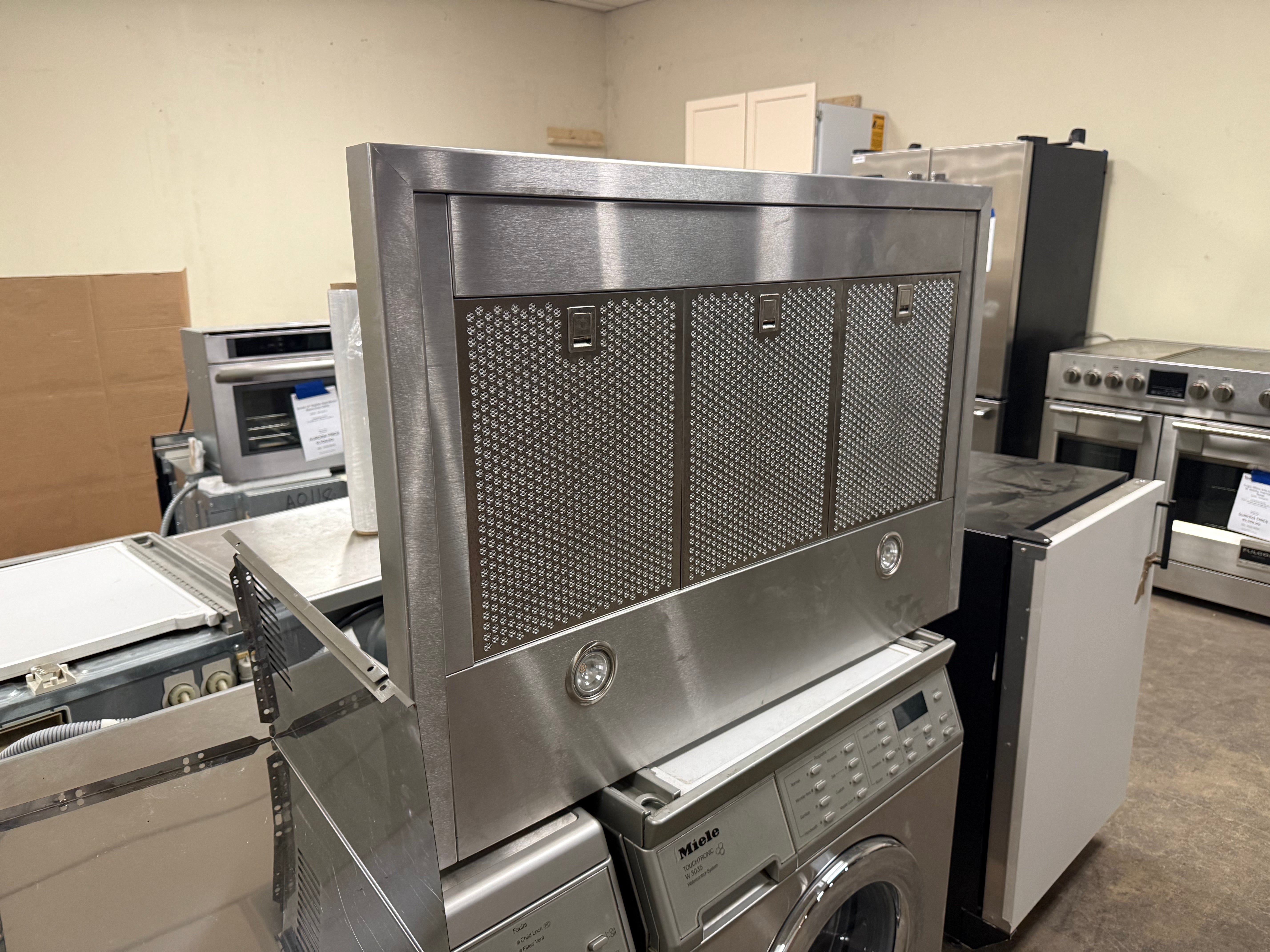 Close up of blue backlit touch controls on XO XOV36KS range hood