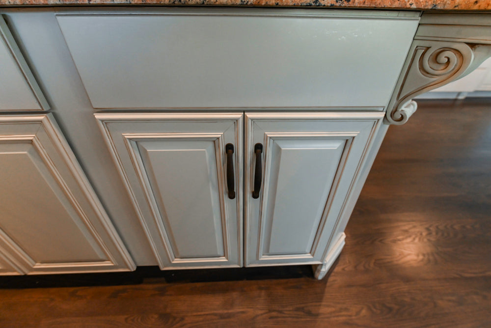 Schrock Traditional Cream Kitchen with Island and Granite Countertops