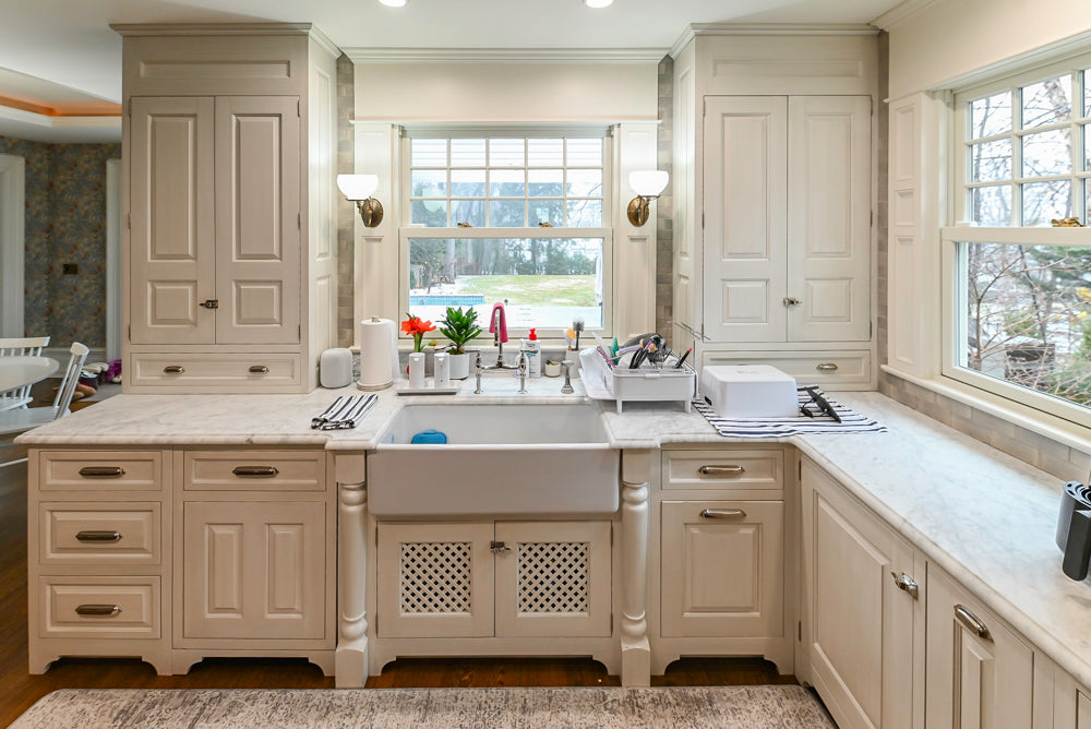Traditional White Kitchen with Island, Marble Countertops and La Cornue Range with Matching Hood