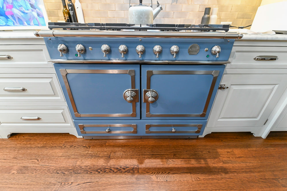 Canterbury Traditional White Kitchen with Island, Marble Countertops and La Cornue Range with Matching Hood