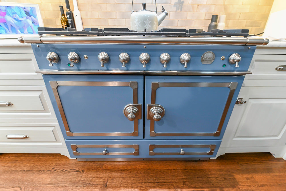 Canterbury Traditional White Kitchen with Island, Marble Countertops and La Cornue Range with Matching Hood