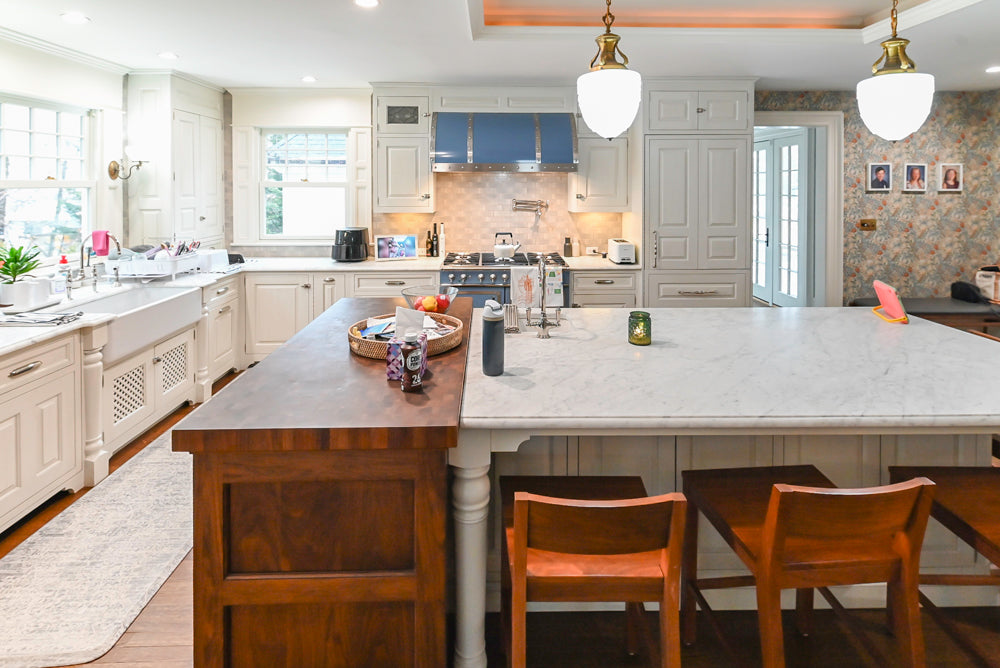 Traditional White Kitchen with Island, Marble Countertops and La Cornue Range with Matching Hood