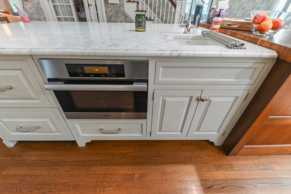 Canterbury Traditional White Kitchen with Island, Marble Countertops and La Cornue Range with Matching Hood