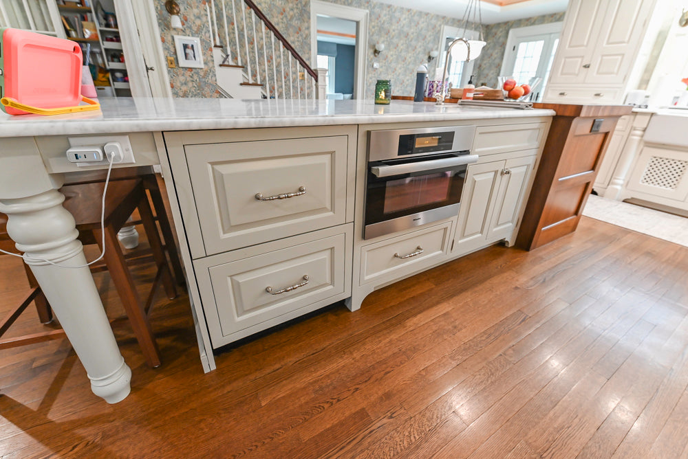 Traditional White Kitchen with Island, Marble Countertops and La Cornue Range with Matching Hood