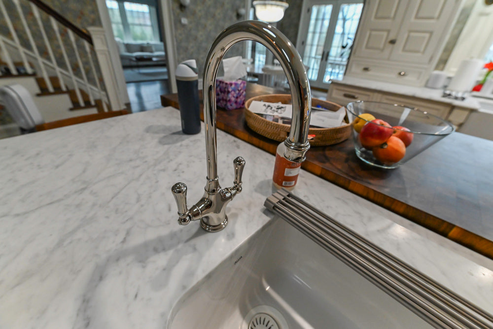 Canterbury Traditional White Kitchen with Island, Marble Countertops and La Cornue Range with Matching Hood