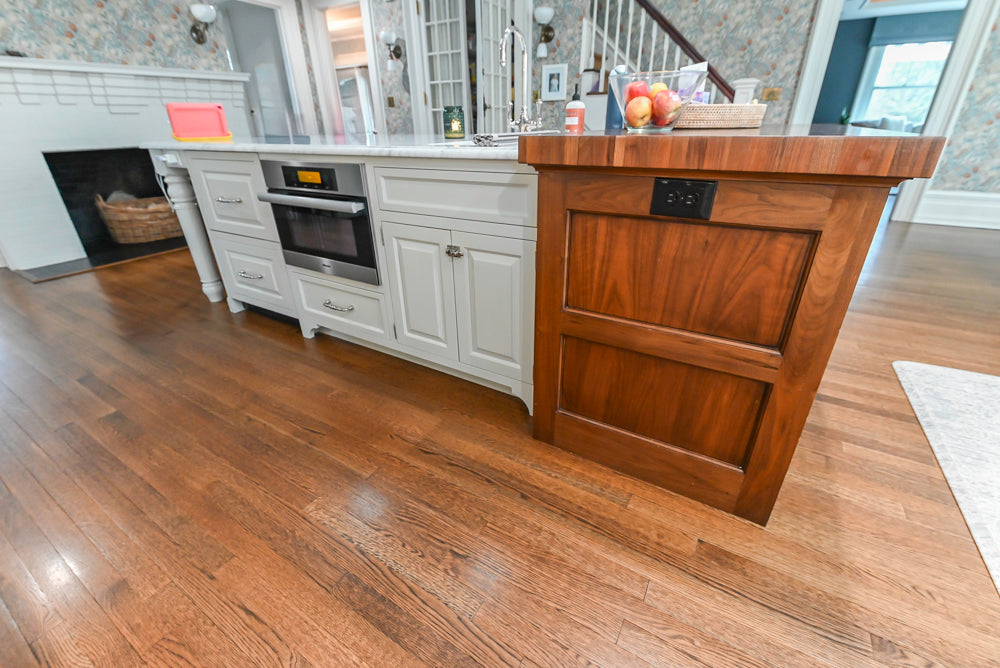Traditional White Kitchen with Island, Marble Countertops and La Cornue Range with Matching Hood