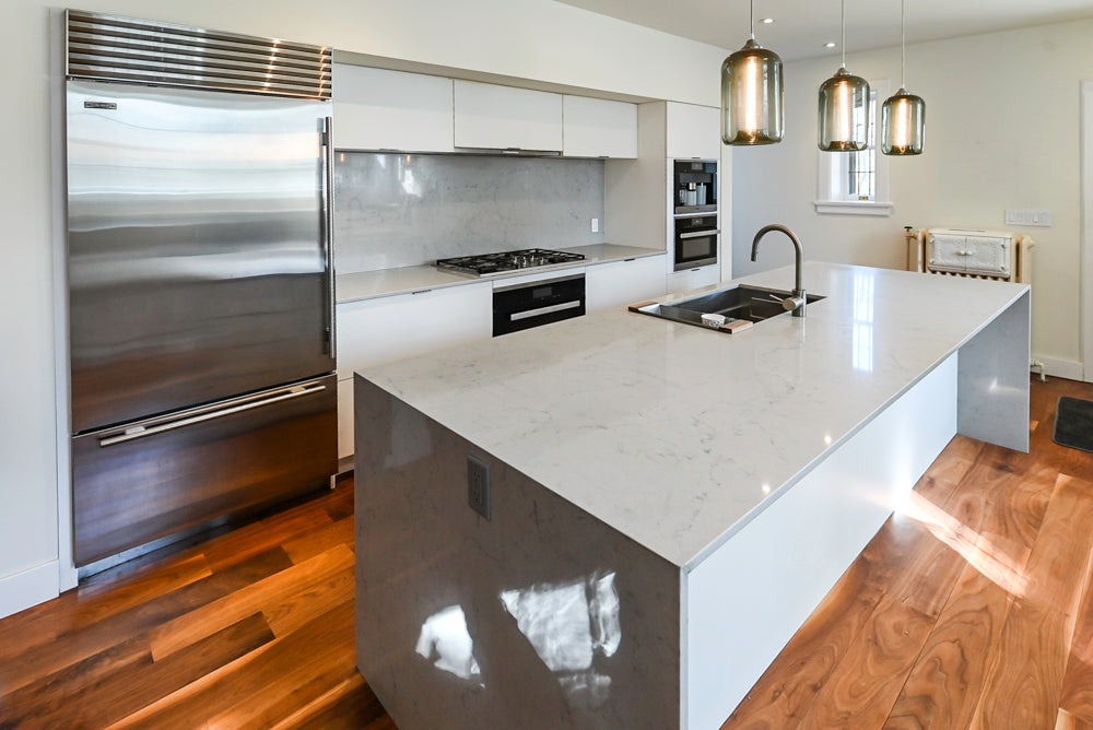 Modern Matte White Kitchen with Waterfall Island, Quartz Countertops & Miele Appliances