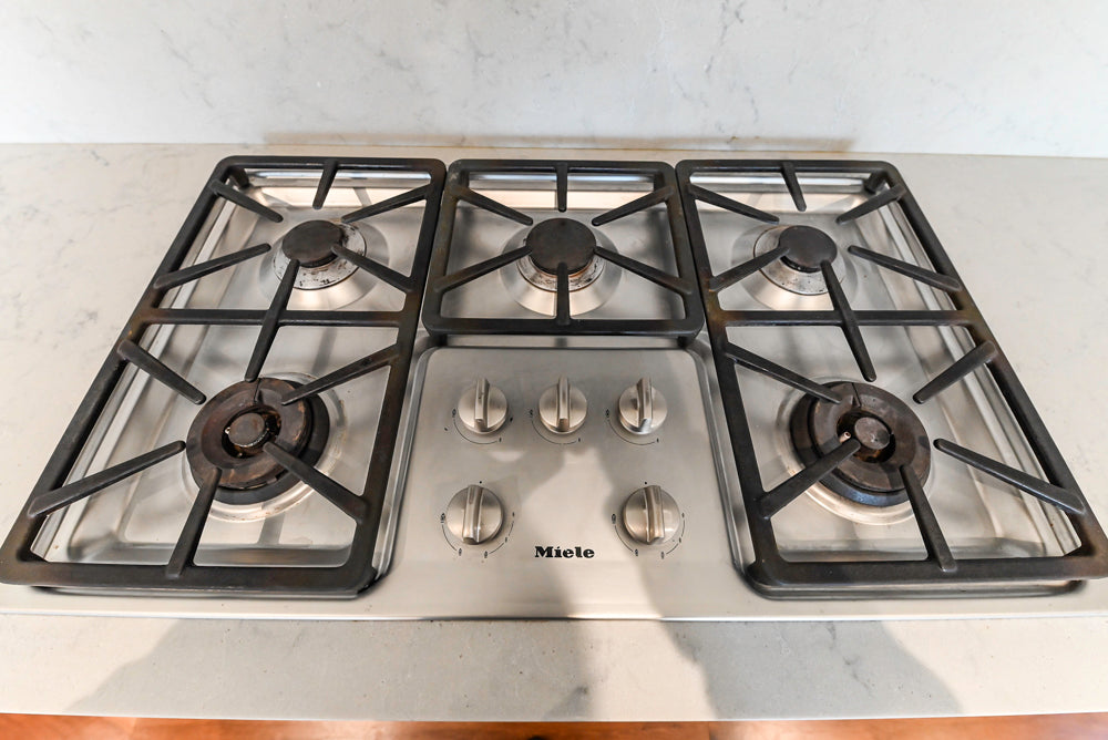 Modern Matte White Kitchen with Waterfall Island, Quartz Countertops & Miele Appliances
