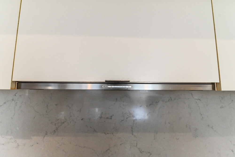 Modern Matte White Kitchen with Waterfall Island, Quartz Countertops & Miele Appliances