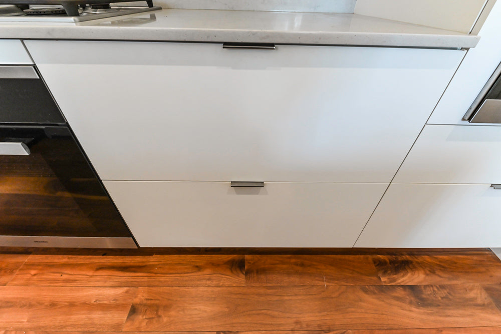 Modern Matte White Kitchen with Waterfall Island, Quartz Countertops & Miele Appliances