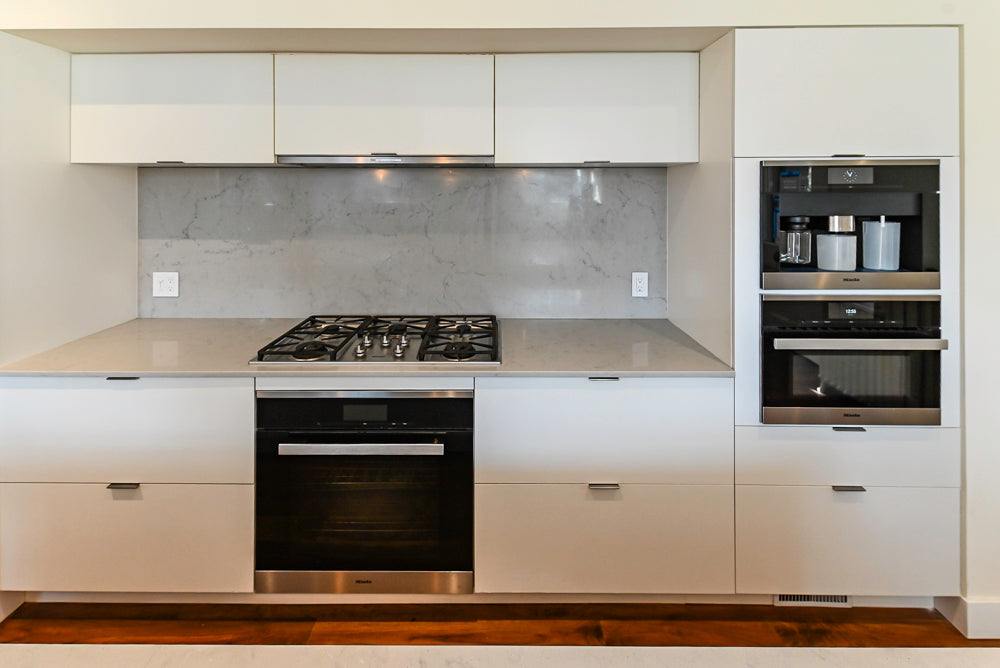 Modern Matte White Kitchen with Waterfall Island, Quartz Countertops & Miele Appliances