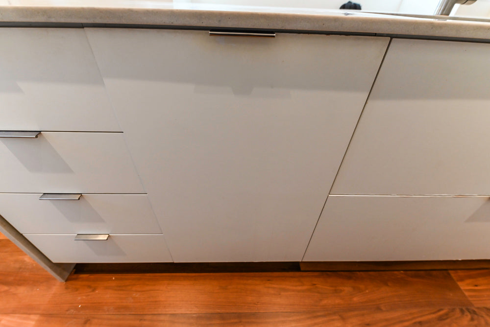 Modern Matte White Kitchen with Waterfall Island, Quartz Countertops & Miele Appliances