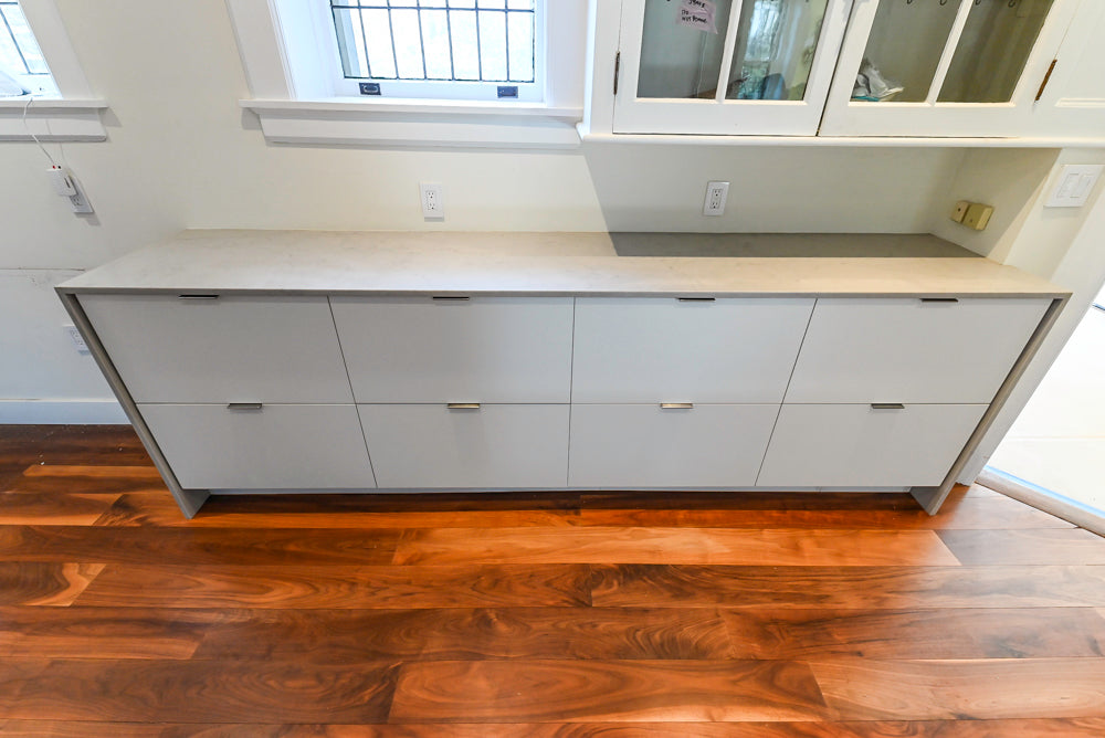 Modern Matte White Kitchen with Waterfall Island, Quartz Countertops & Miele Appliances