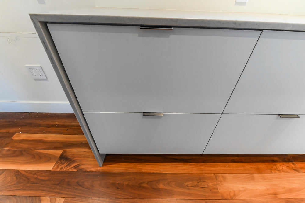 Modern Matte White Kitchen with Waterfall Island, Quartz Countertops & Miele Appliances