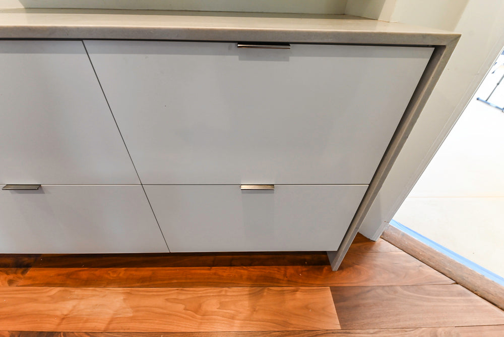 Modern Matte White Kitchen with Waterfall Island, Quartz Countertops & Miele Appliances