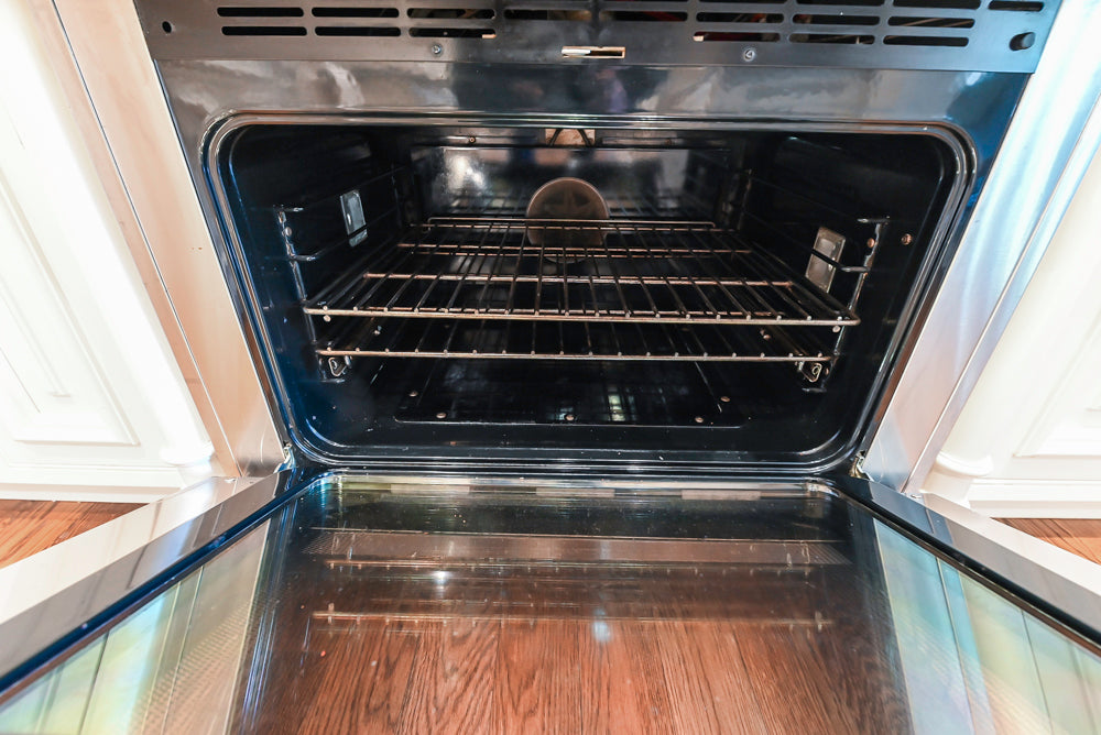 Quakermaid Traditional White Kitchen with Marble Countertops and Luxe Appliances