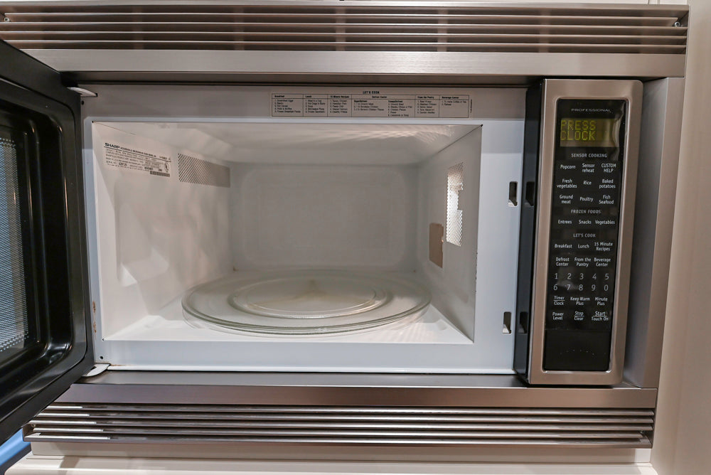 Quakermaid Traditional White Kitchen with Marble Countertops and Luxe Appliances