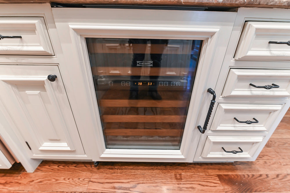 Quakermaid Traditional White Kitchen with Marble Countertops and Luxe Appliances