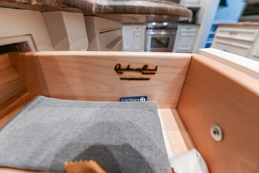 Quakermaid Traditional White Kitchen with Marble Countertops and Luxe Appliances