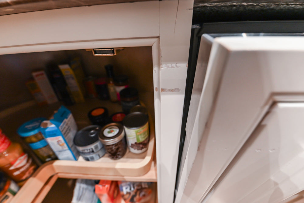 Quakermaid Traditional White Kitchen with Marble Countertops and Luxe Appliances