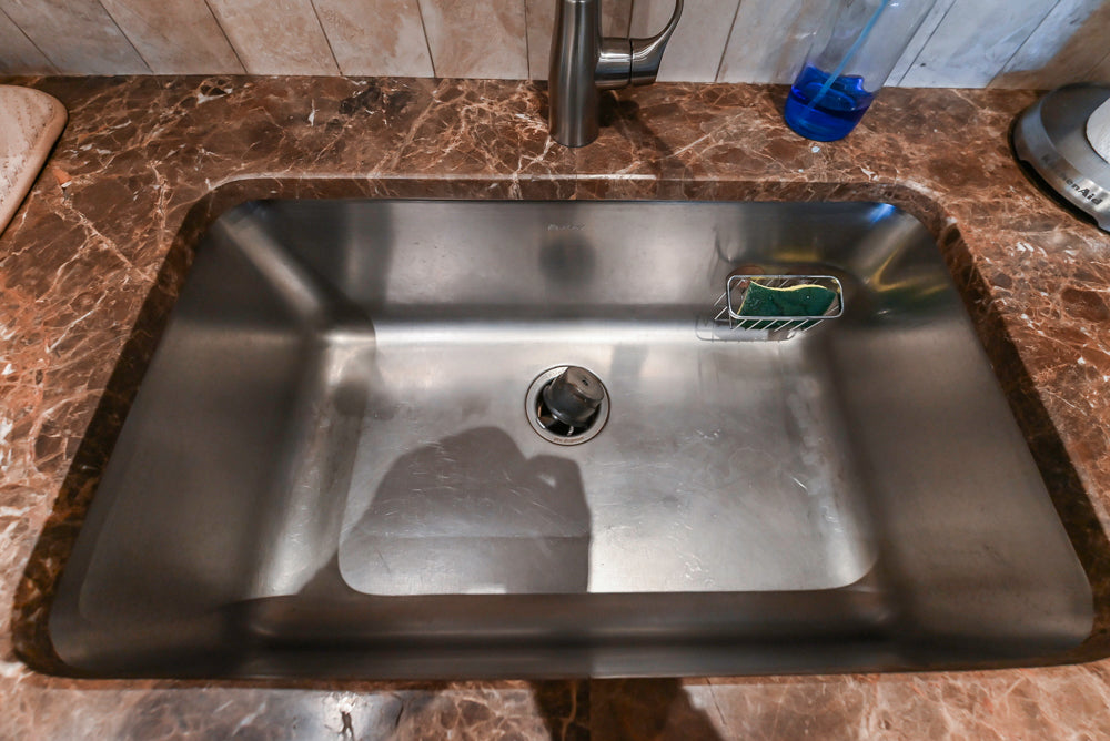 Quakermaid Traditional White Kitchen with Marble Countertops and Luxe Appliances