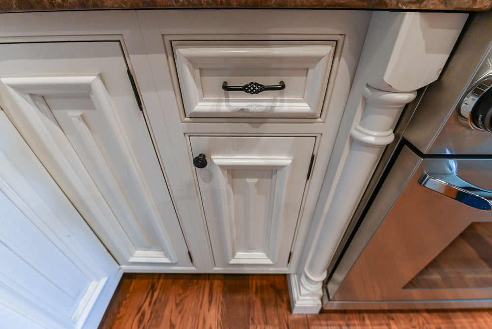 Quakermaid Traditional White Kitchen with Marble Countertops and Luxe Appliances