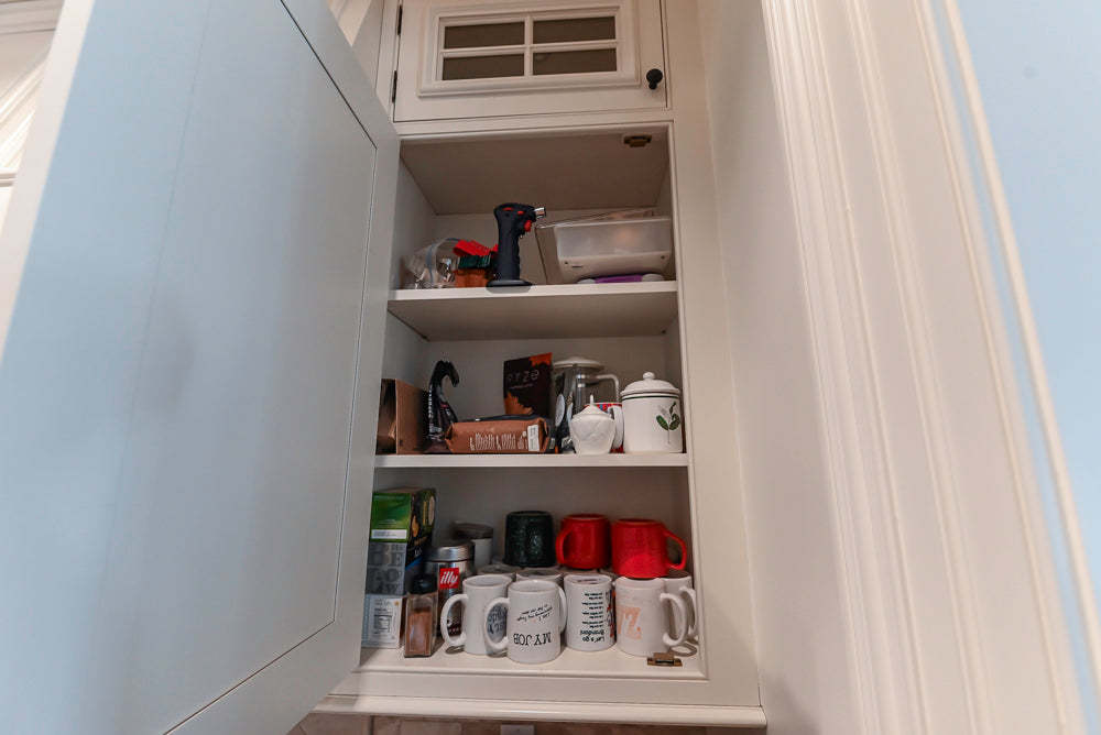 Quakermaid Traditional White Kitchen with Marble Countertops and Luxe Appliances