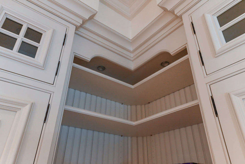 Quakermaid Traditional White Kitchen with Marble Countertops and Luxe Appliances