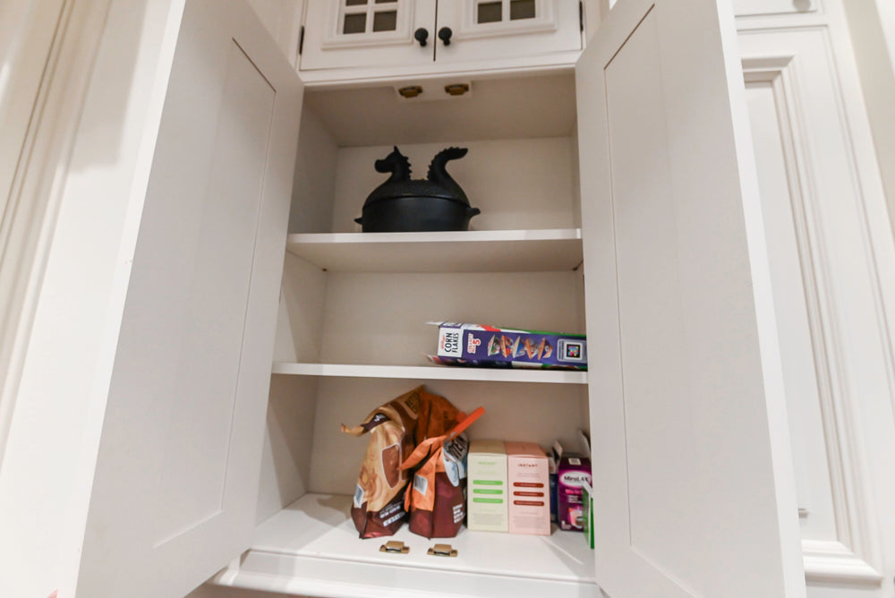 Quakermaid Traditional White Kitchen with Marble Countertops and Luxe Appliances