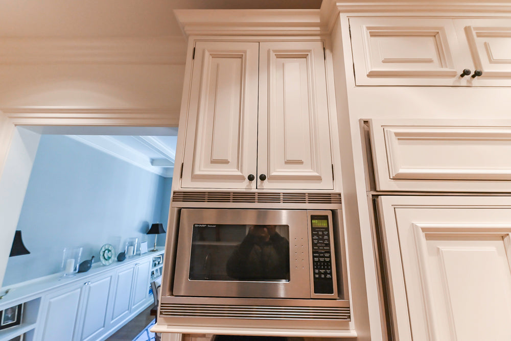 Quakermaid Traditional White Kitchen with Marble Countertops and Luxe Appliances