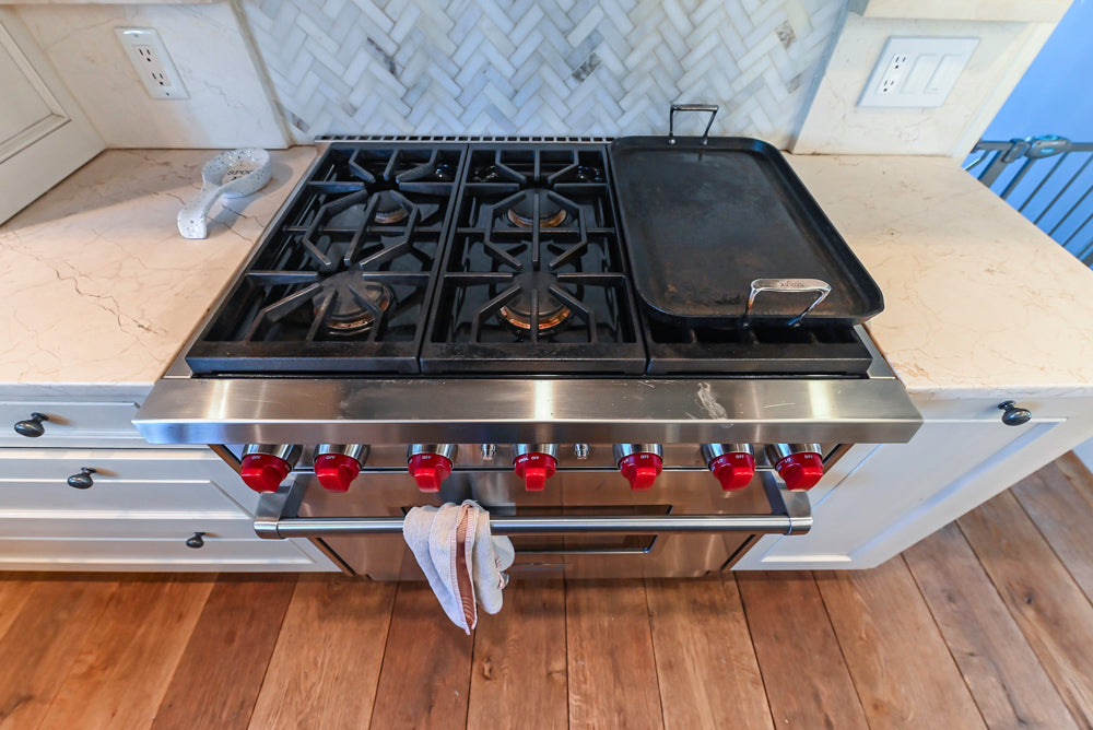 Wood-Mode Traditional Light Cream Kitchen with Marble Countertops and Wolf Range
