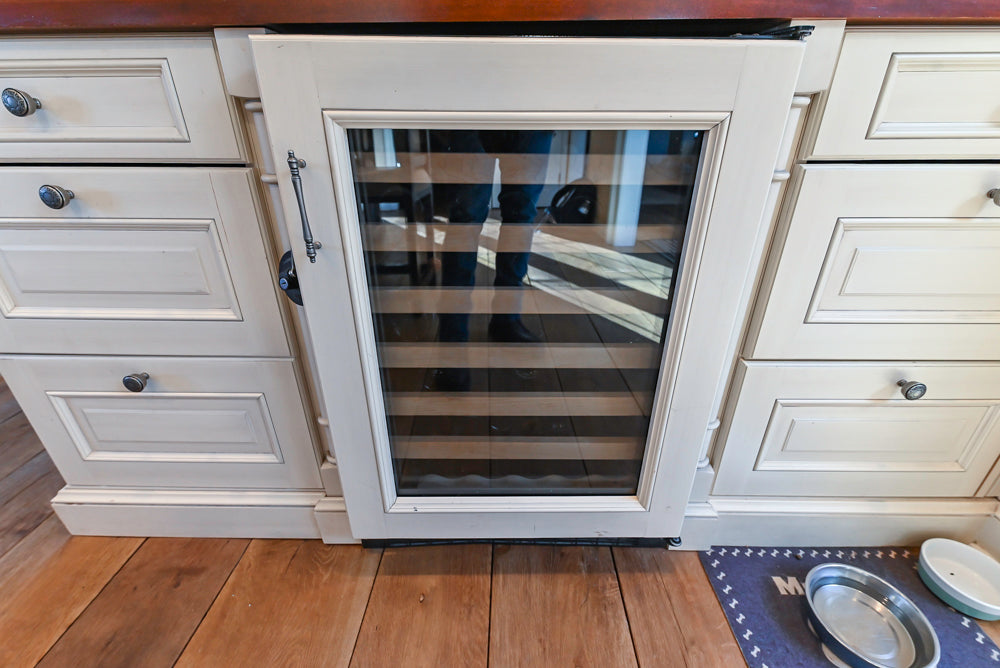 Wood-Mode Traditional Light Cream Kitchen with Marble Countertops and Wolf Range