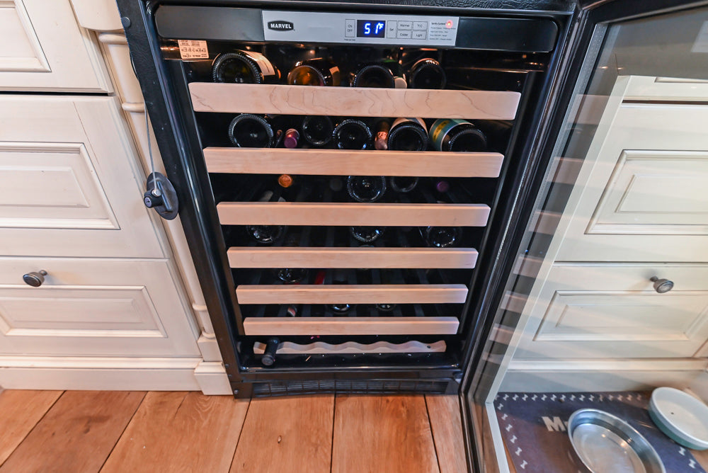 Wood-Mode Traditional Light Cream Kitchen with Marble Countertops and Wolf Range