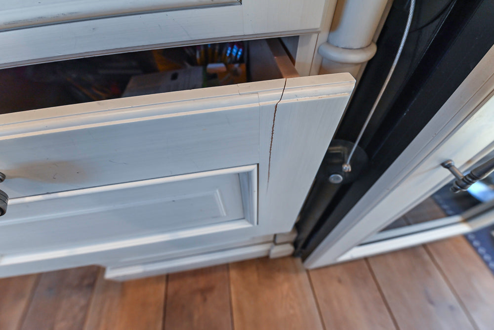 Wood-Mode Traditional Light Cream Kitchen with Marble Countertops and Wolf Range