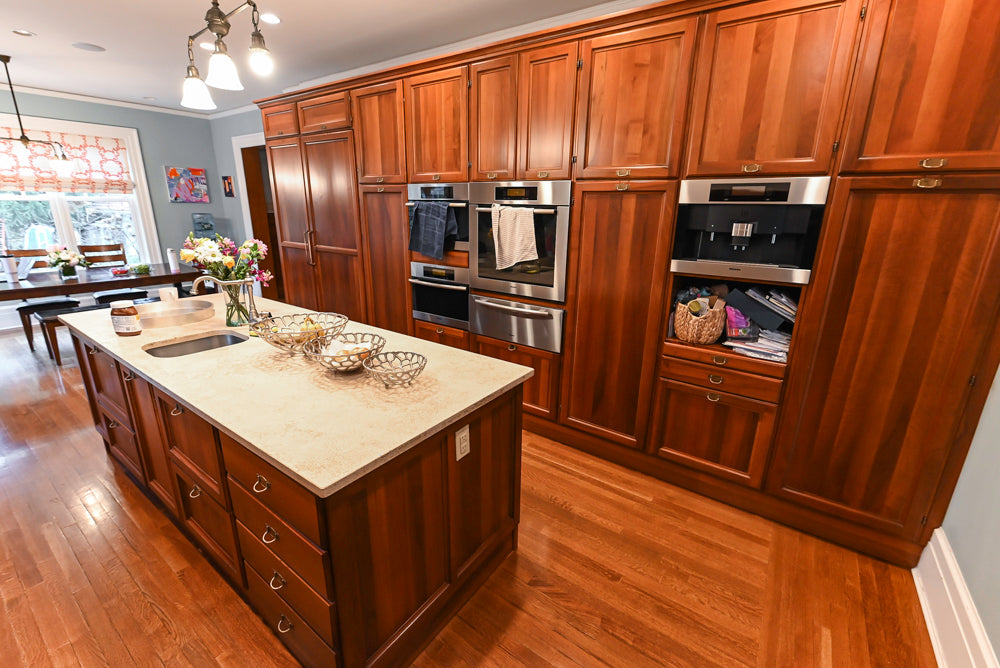 Transitional Wooden Kitchen with Island, Stone Countertops and Miele Appliances