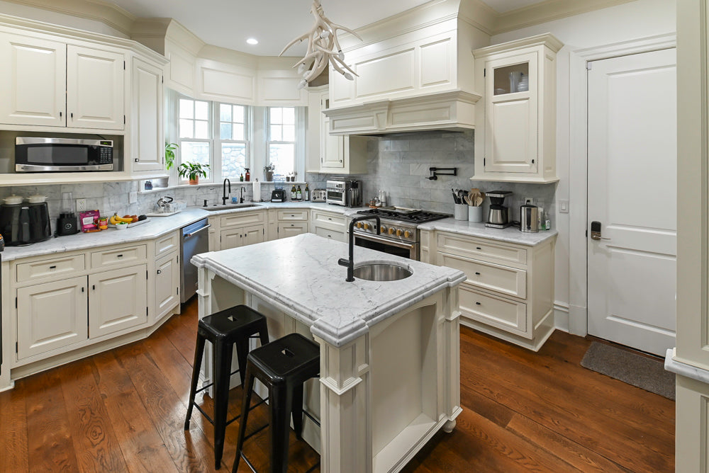 Traditional Creamy White Kitchen with Island, Marble Countertops and Appliances