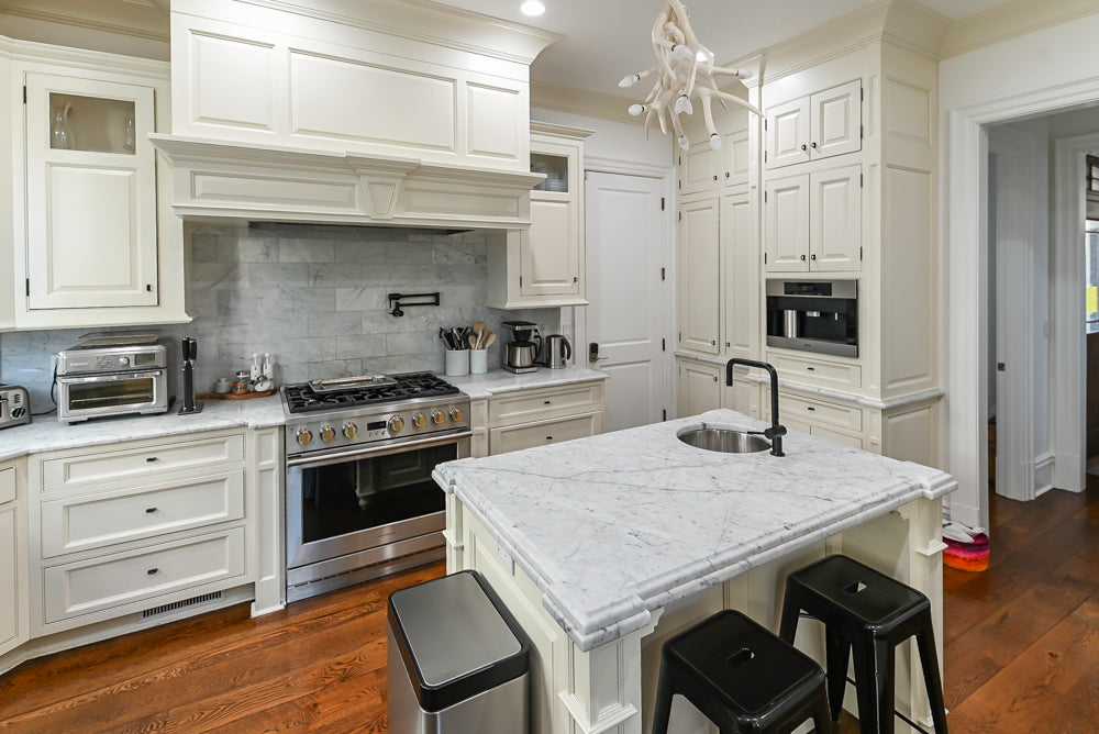 Traditional Creamy White Kitchen with Island, Marble Countertops and Appliances