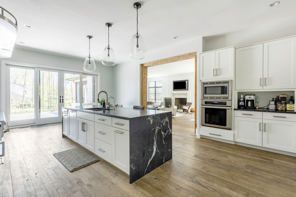 Transitional White Kitchen with Marble Waterfall Island and Thermador Appliances