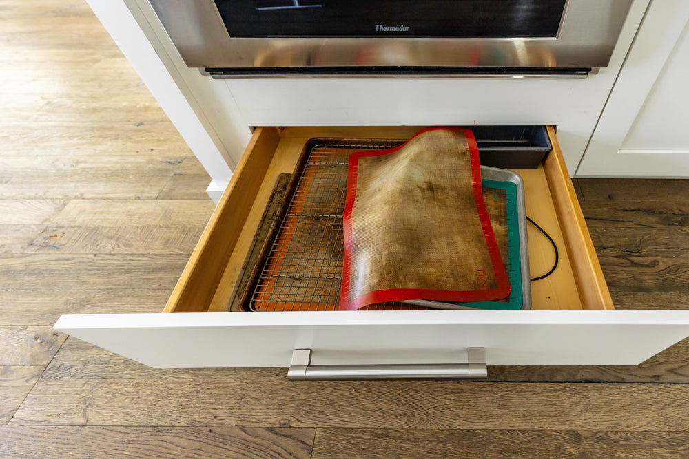 Transitional White Kitchen with Marble Waterfall Island and Thermador Appliances