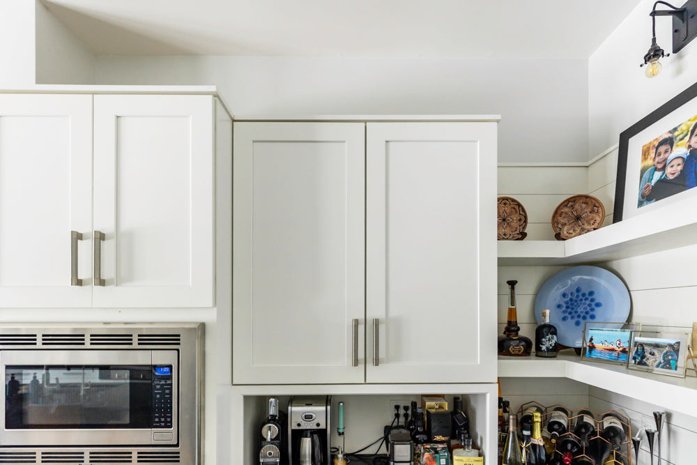 Transitional White Kitchen with Marble Waterfall Island and Thermador Appliances