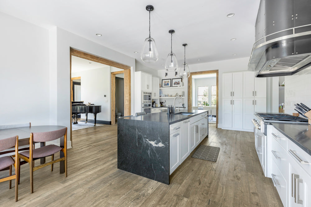 Transitional White Kitchen with Marble Waterfall Island and Thermador Appliances