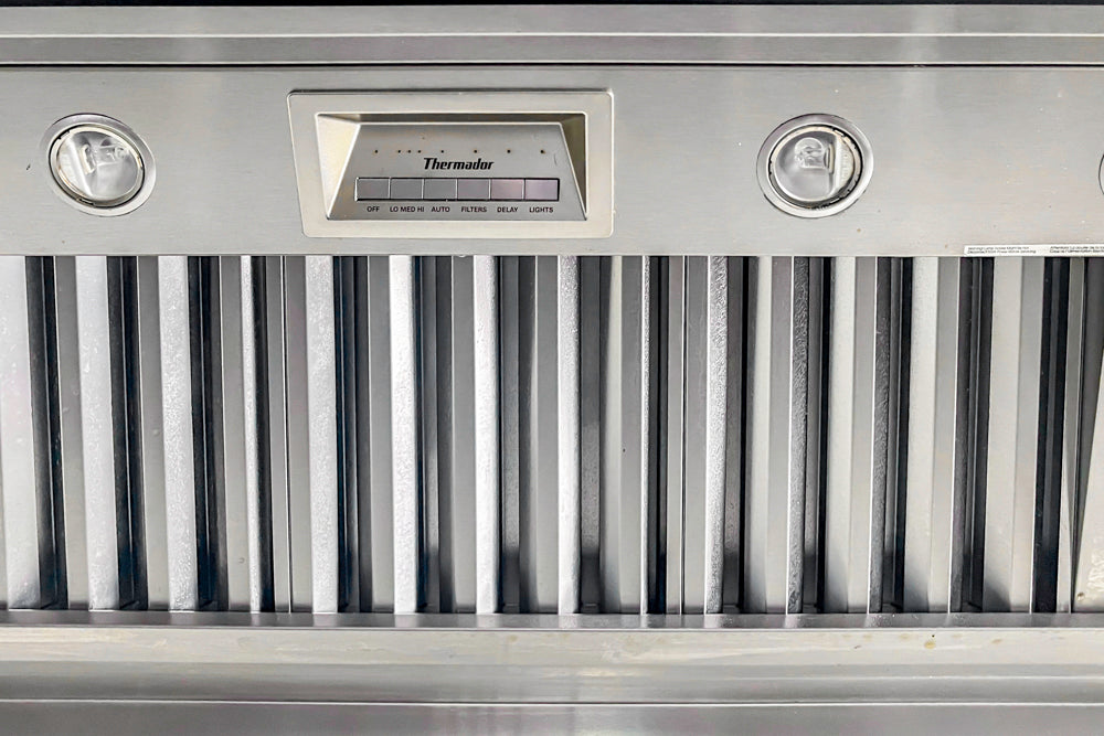 Transitional White Kitchen with Marble Waterfall Island and Thermador Appliances