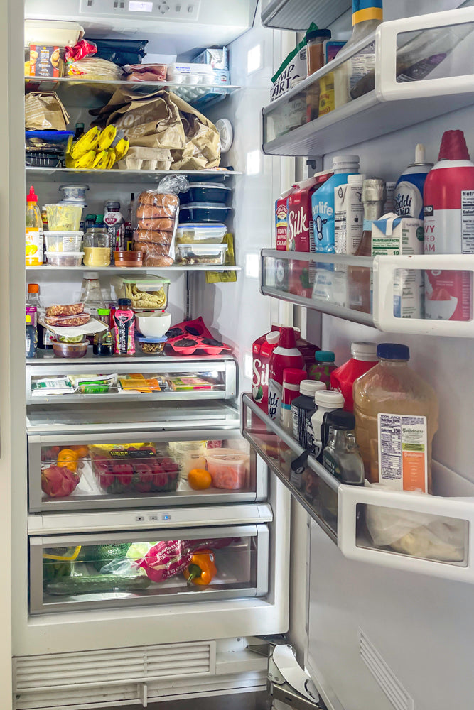 Transitional White Kitchen with Marble Waterfall Island and Thermador Appliances