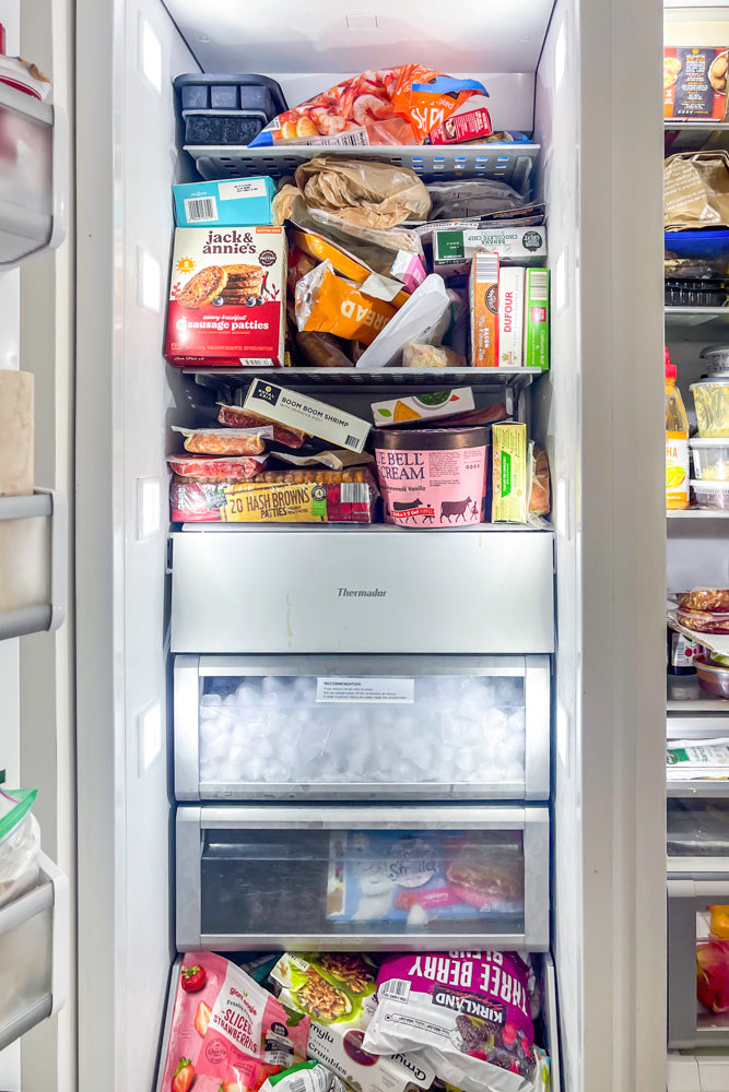 Transitional White Kitchen with Marble Waterfall Island and Thermador Appliances