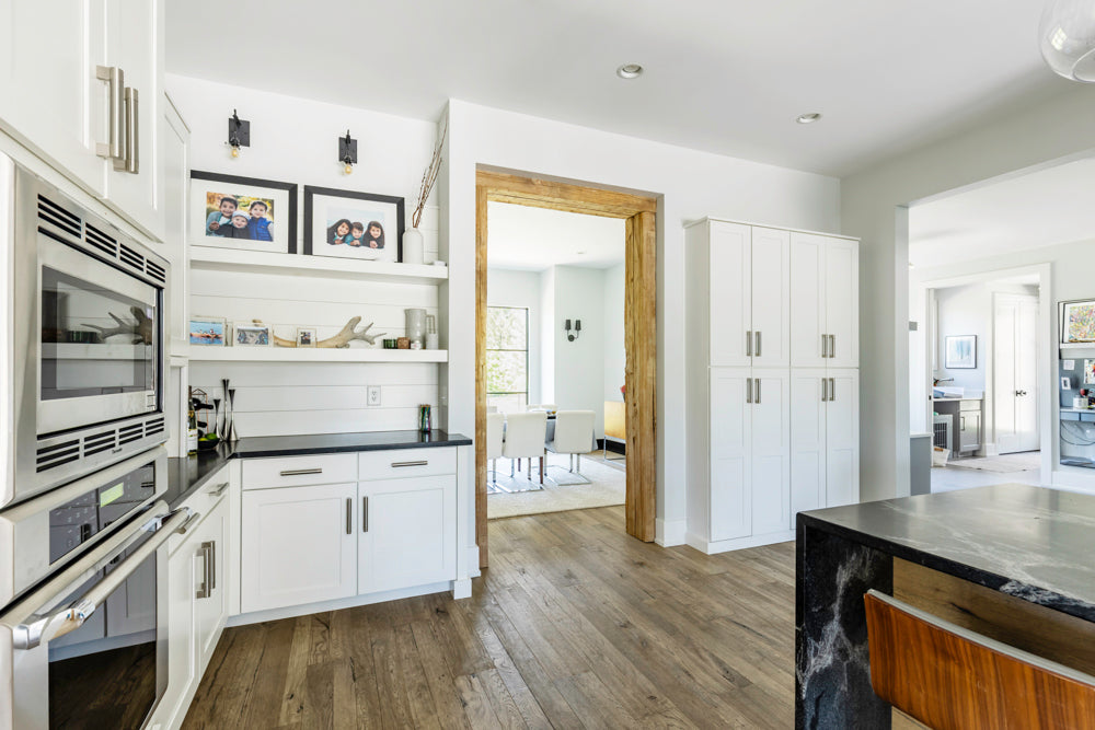 Transitional White Kitchen with Marble Waterfall Island and Thermador Appliances