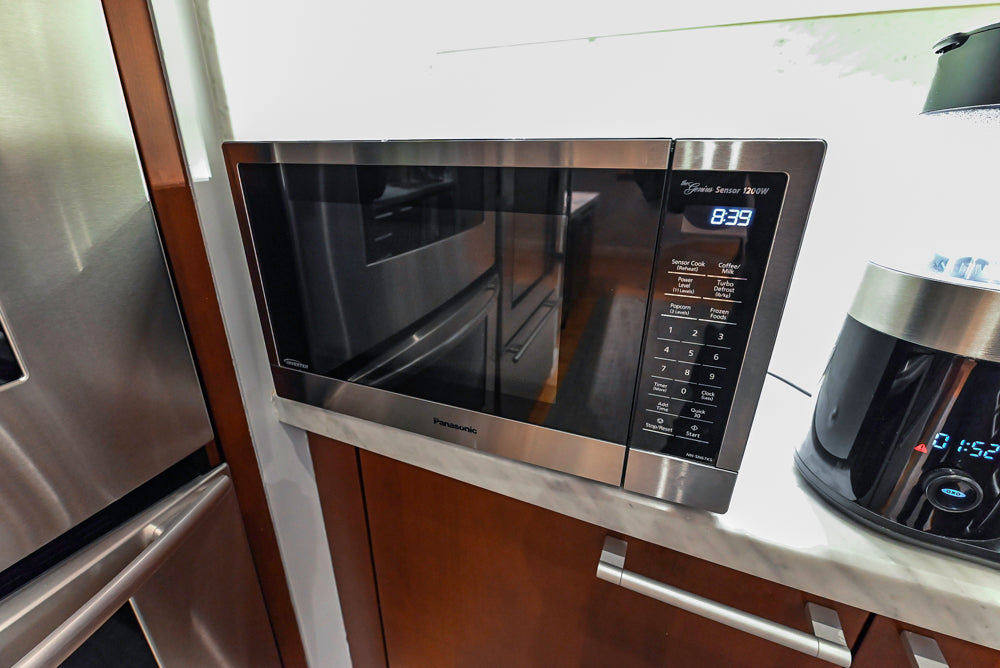 Poggenpohl Brown Toned Transitional Kitchen with Marble Countertops and Appliances