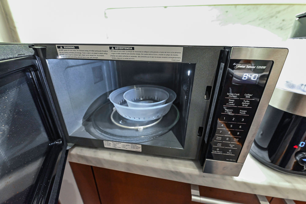 Poggenpohl Brown Toned Transitional Kitchen with Marble Countertops and Appliances